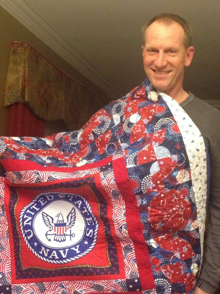 Captain Troy Osten with his Quilt of Valor