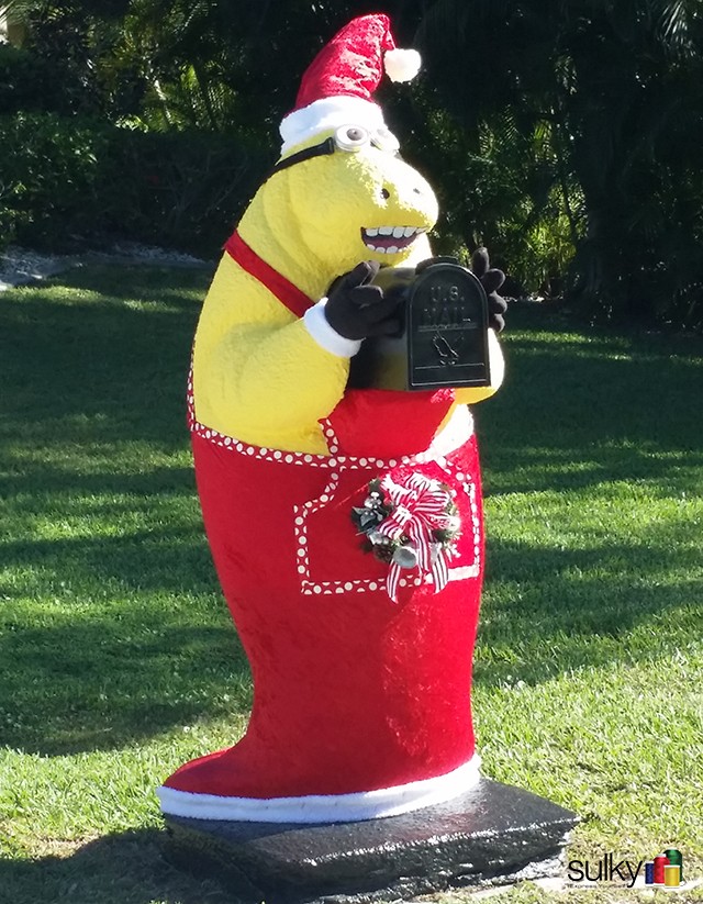 Eric's neighbor has a manatee mailbox. They paint it for all the holidays. Good looking Santa, Mr. manatee!