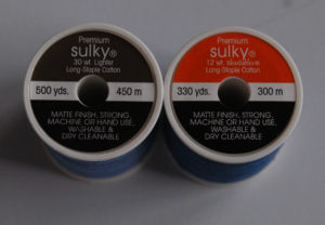 Two premium Sulky light and soft cotton thread spools.