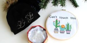 Winter hat, embroidery, and decorative box display.