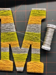 Cotton Thread Wrapped around Wooden Letter