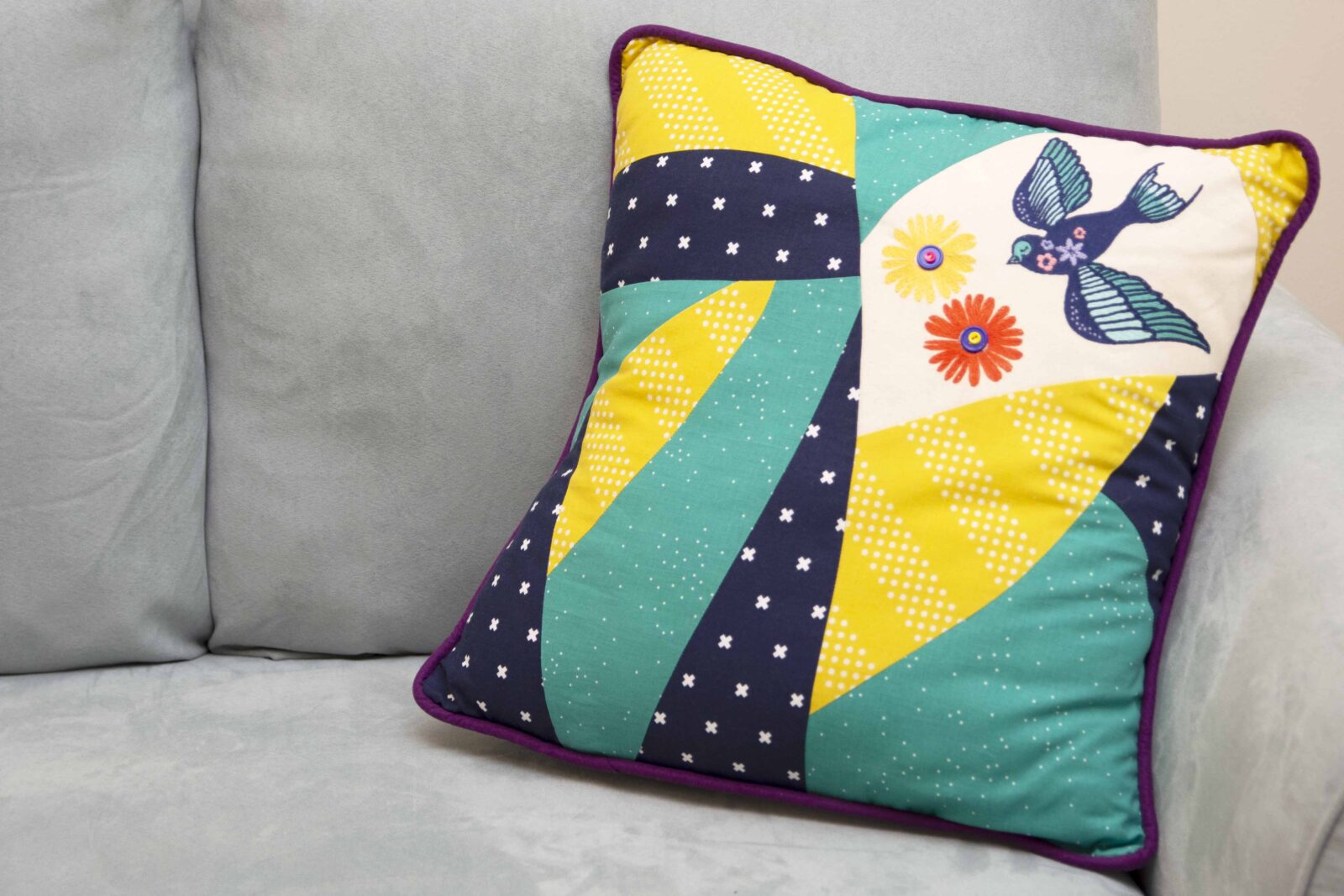 pieced pillow with embroidery