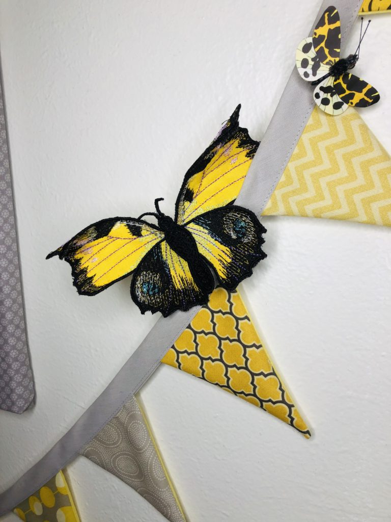 3-D machine embroidery butterfly on garland