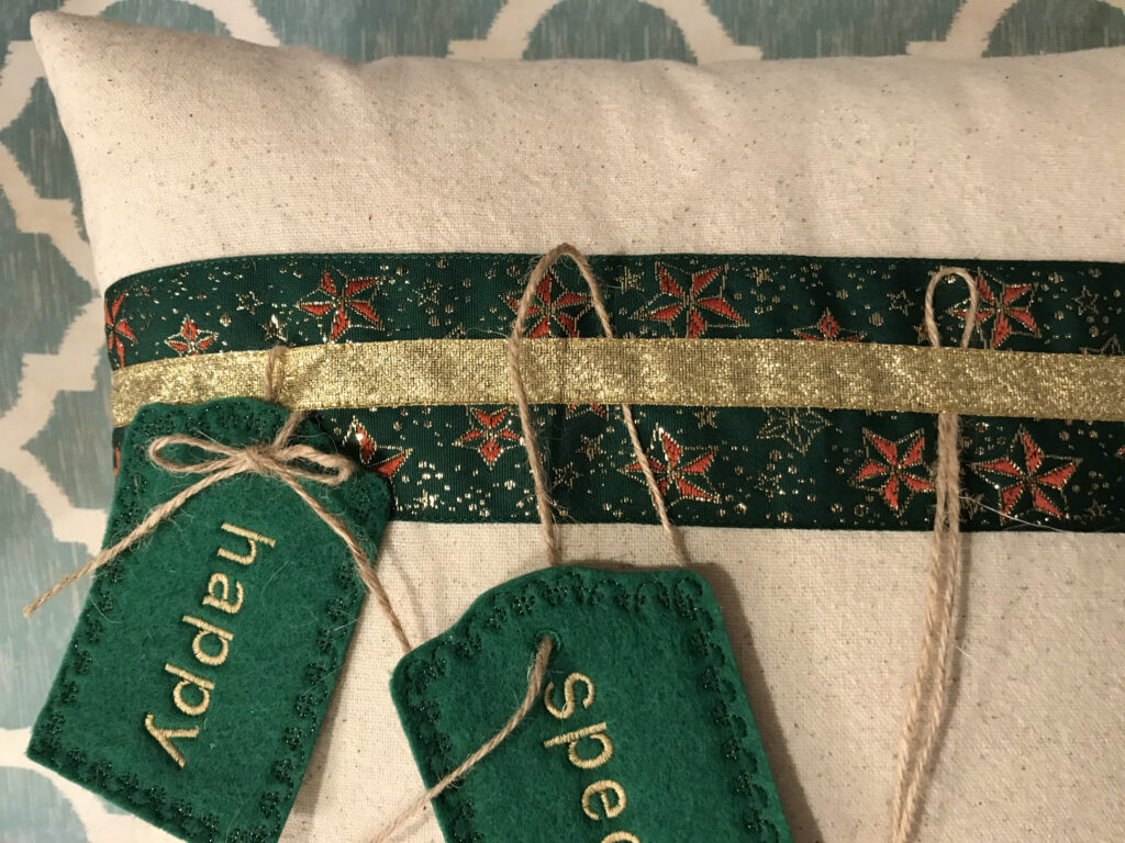 embroidered tags on christmas pillow