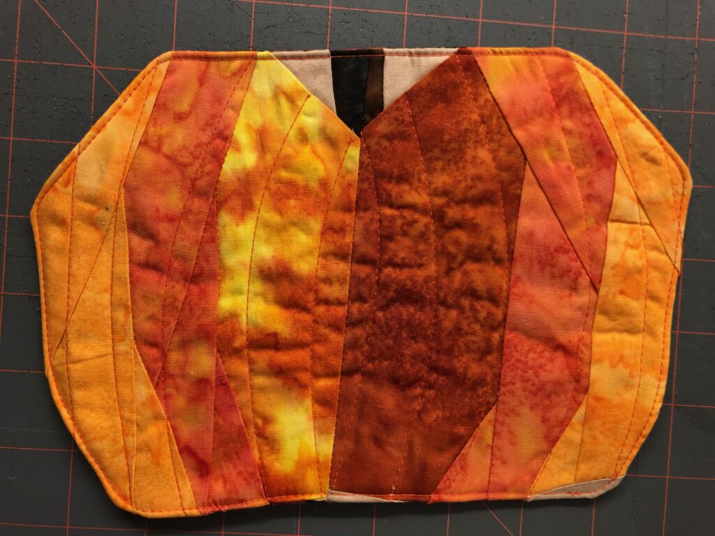 paper pieced pumpkin with stitching detail