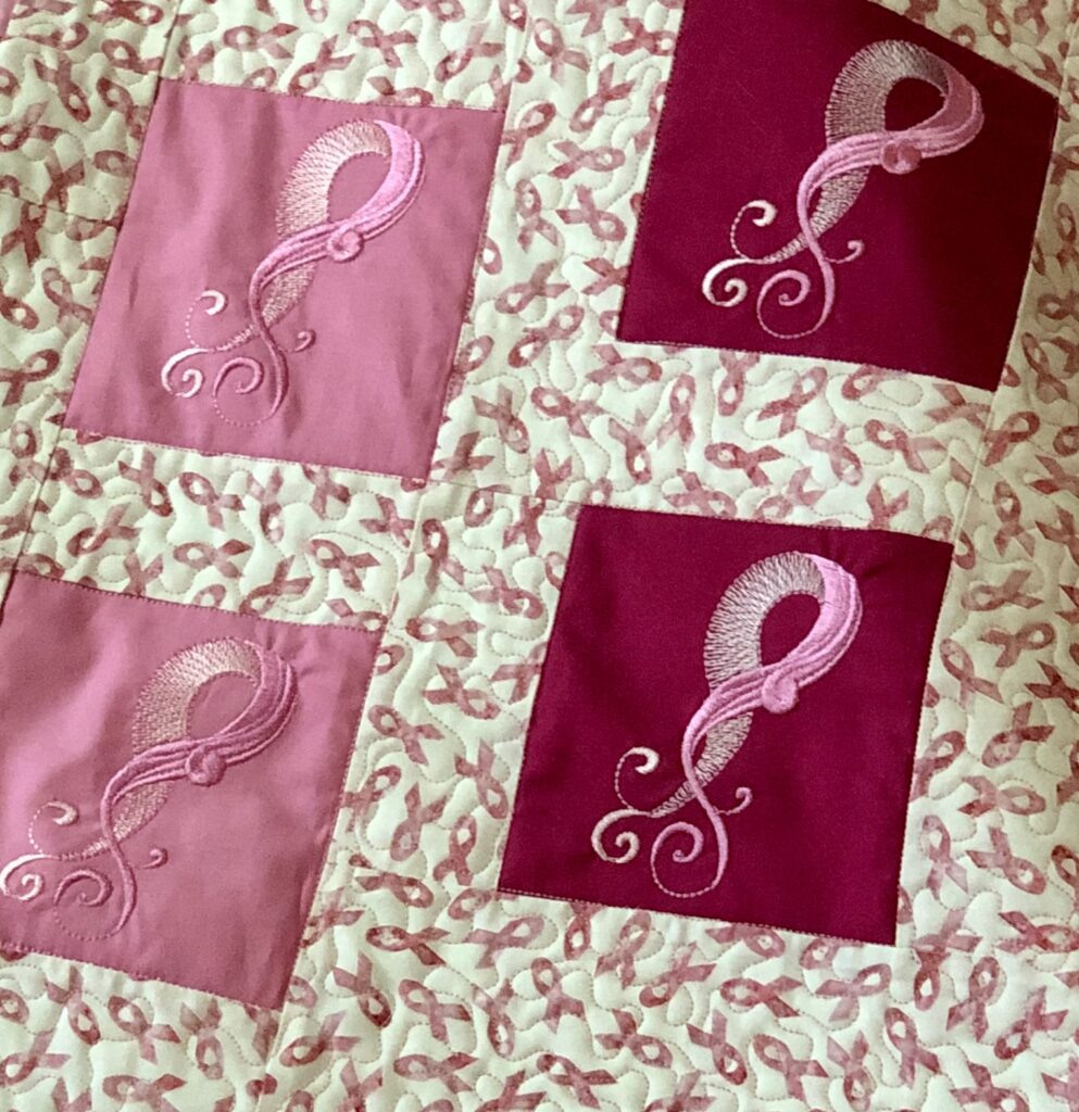 pink ribbon embroidery design closeup