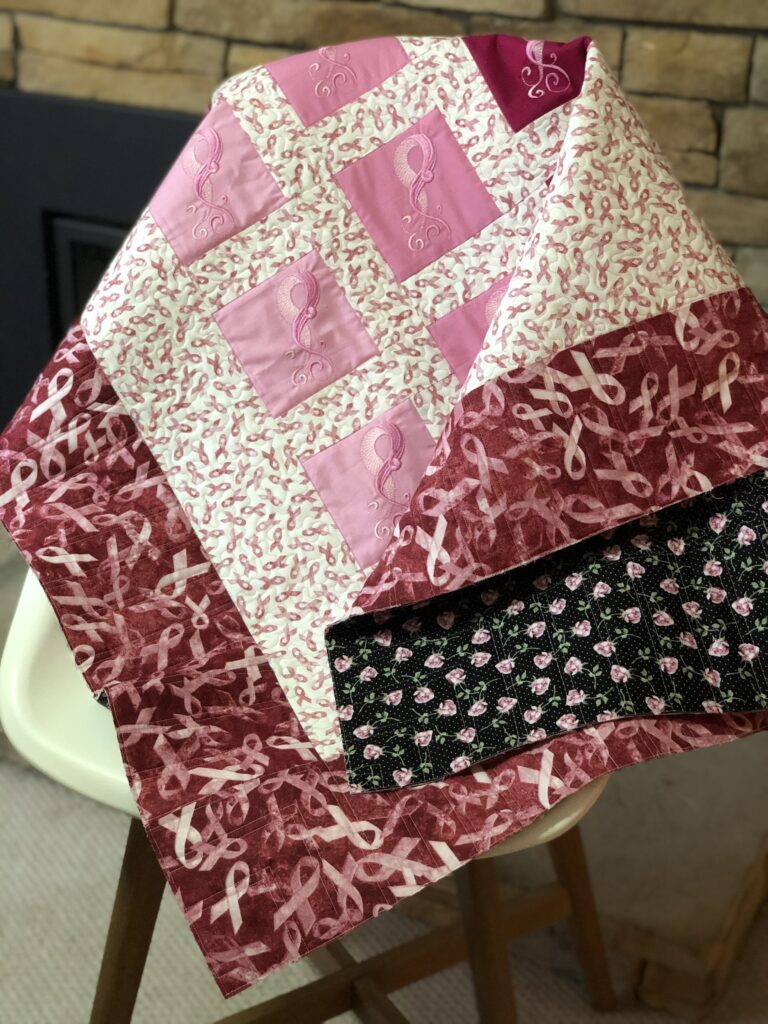 breast cancer quilt with backing showing