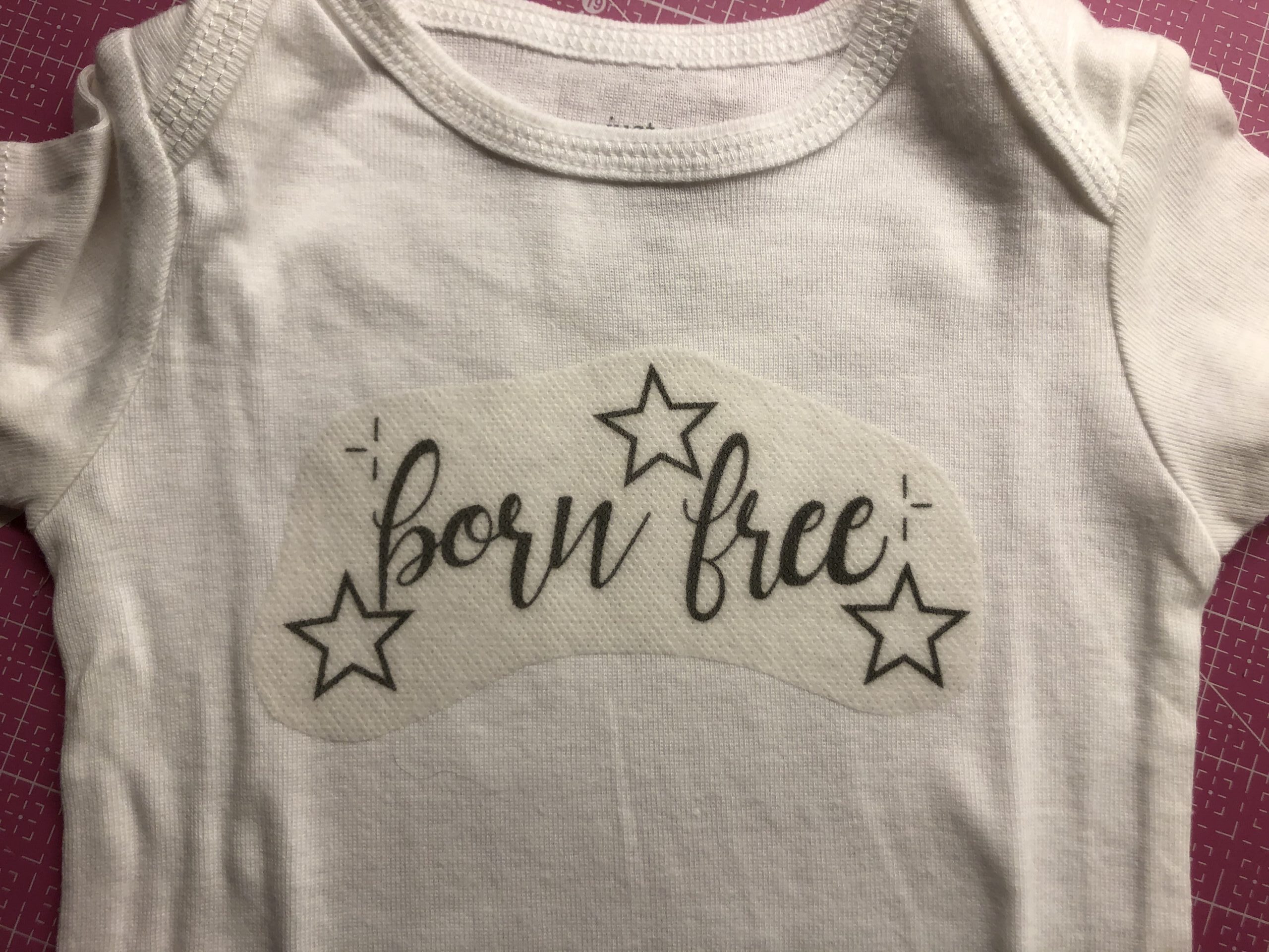embroidered onesie with stabilizer attached