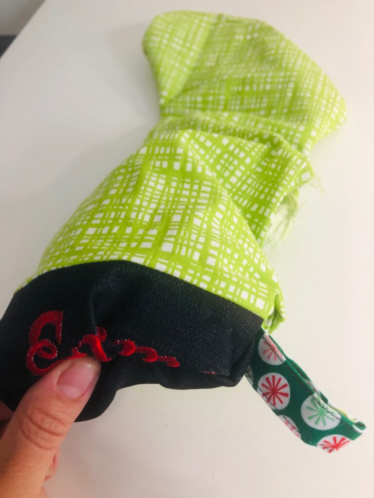 turn embroidered christmas stocking right side out through opening