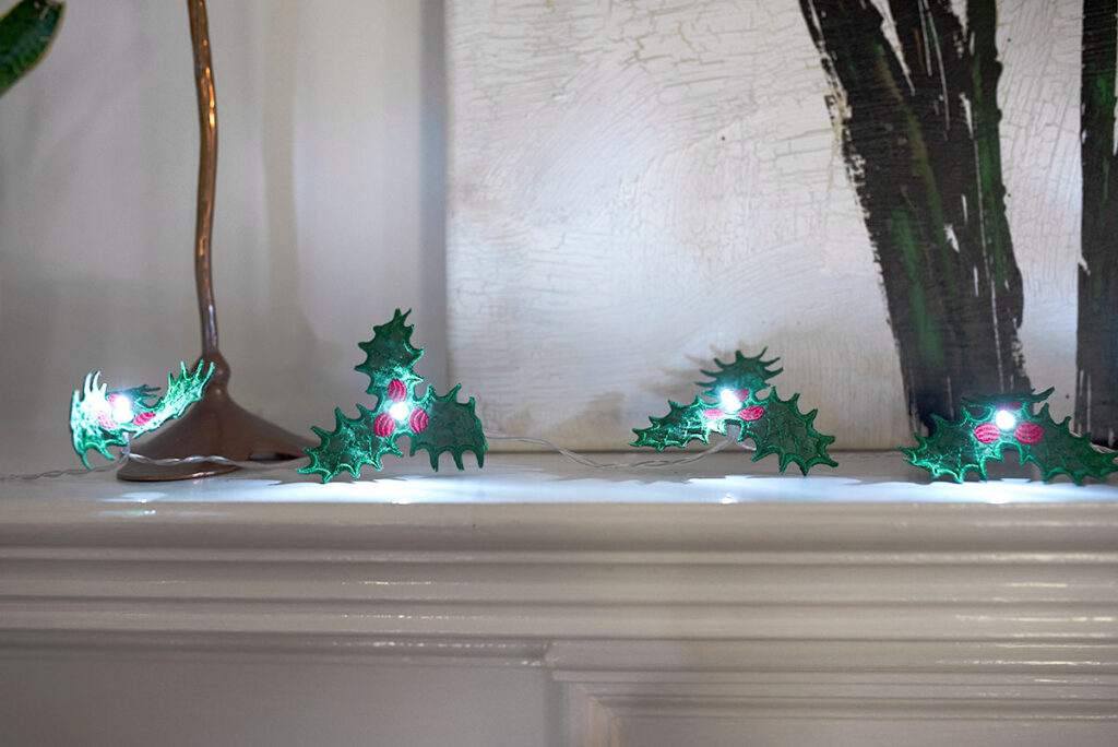 Free embroidery design holly string lights