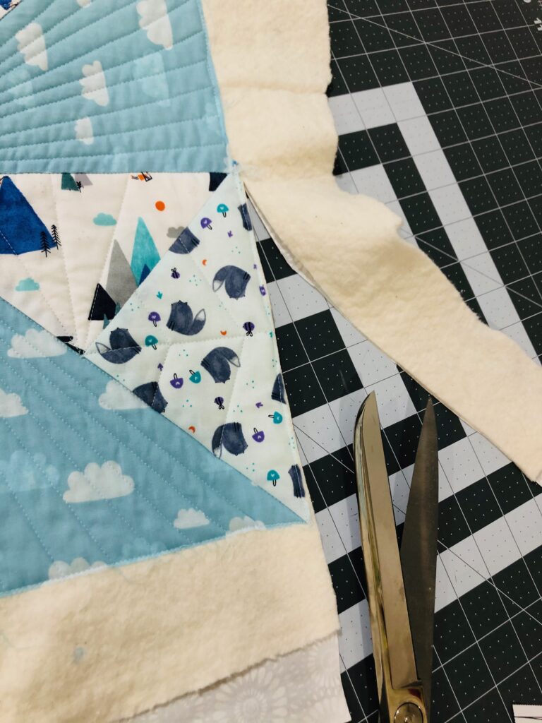 trim baby quilt edges