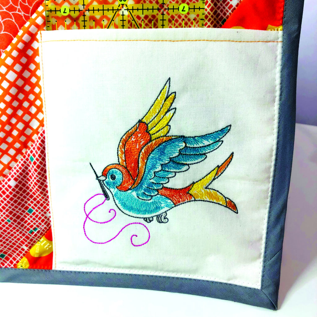 pocket detail showing embroidery on cover