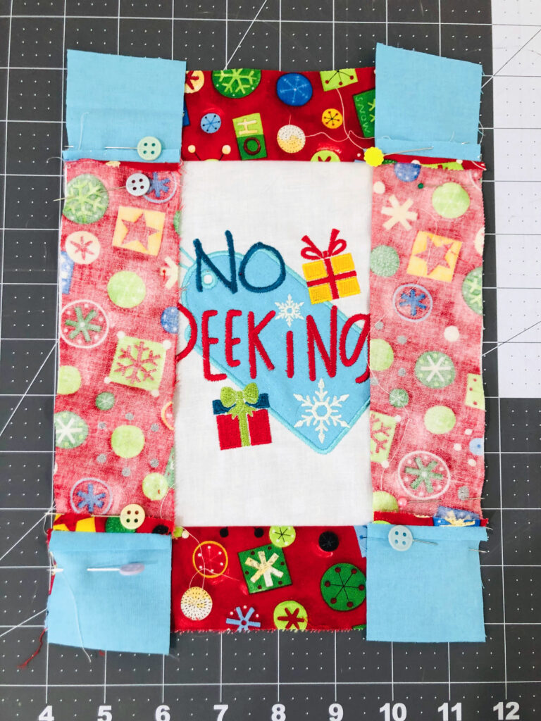 stitching side borders to mini quilt