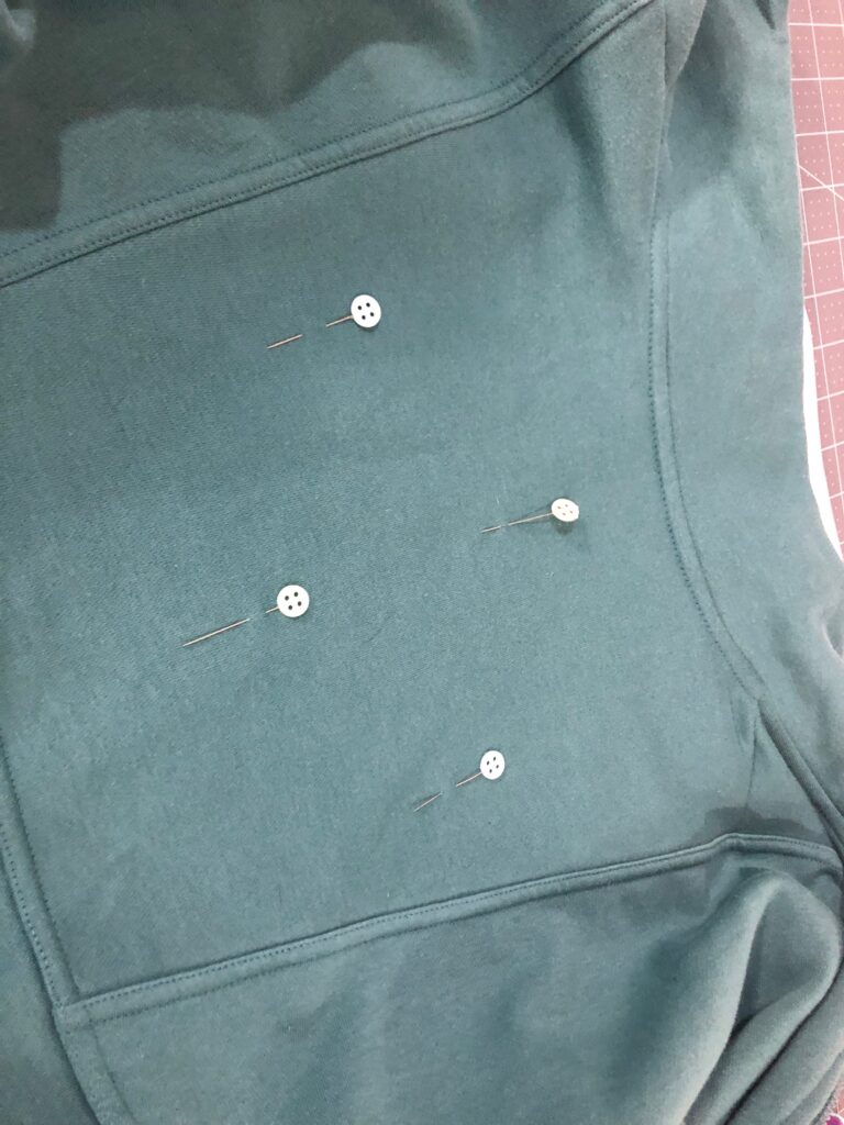 placement pins for embroidery design on sweatshirt