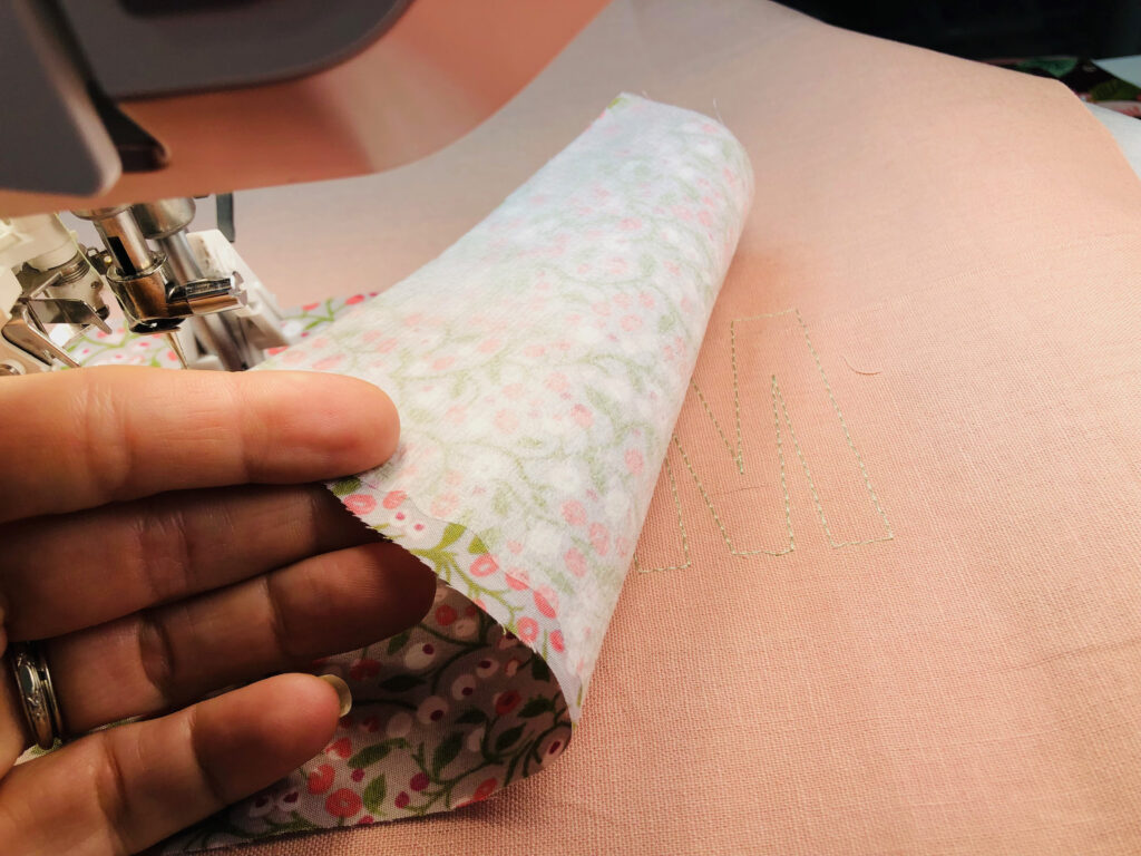 placing fabric after placement stitching