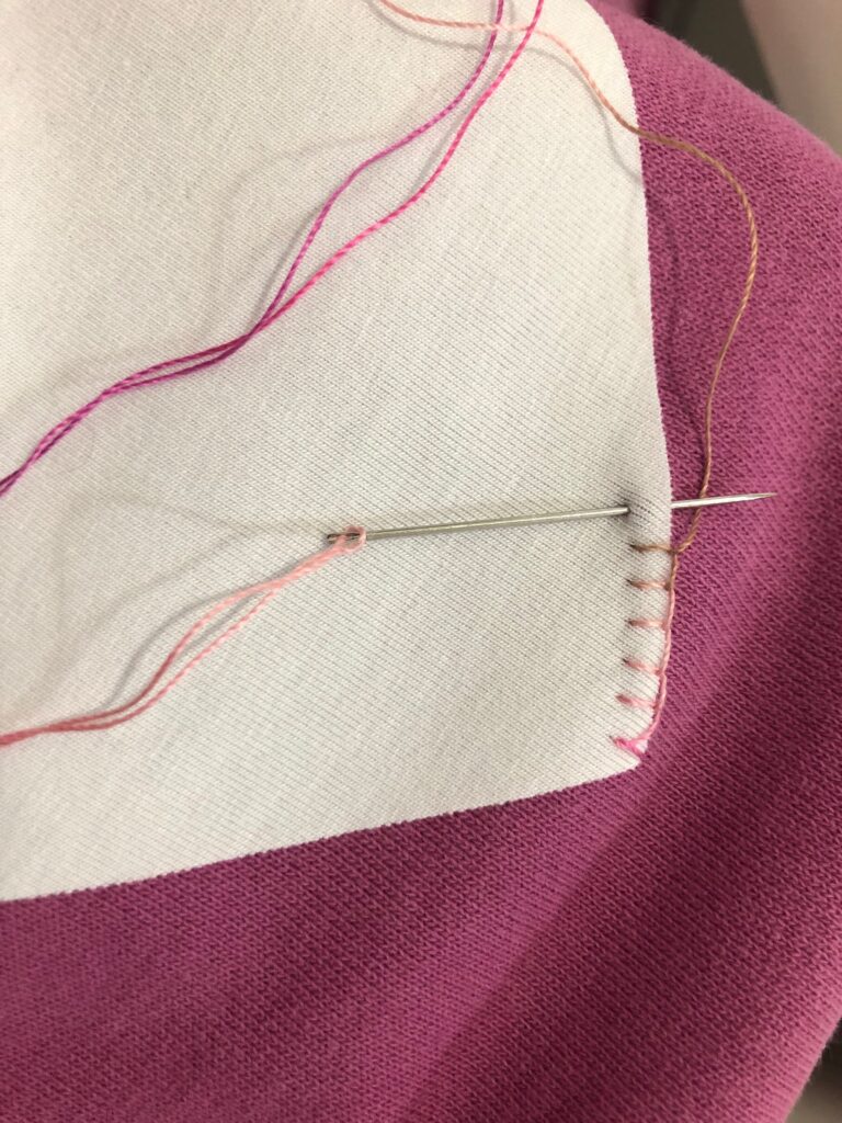 beginning of blanket stitching on sleeve