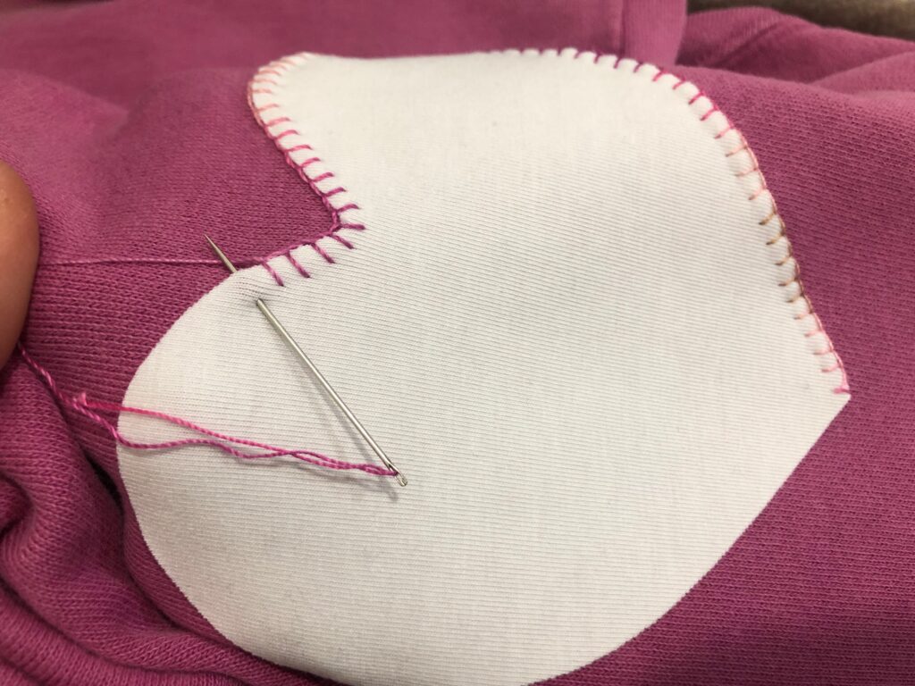 blanket stitching on sweatshirt in progress