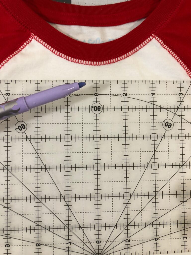 measuring for embroidery placement on tee