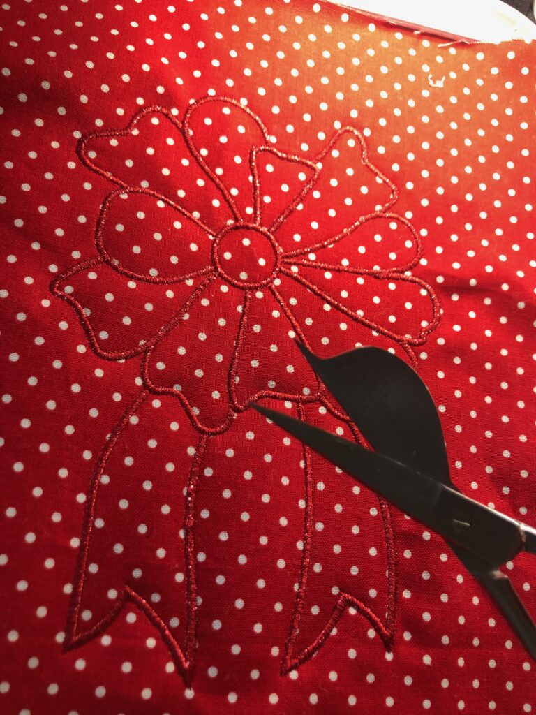 finished ribbon stitching on pillow fabric