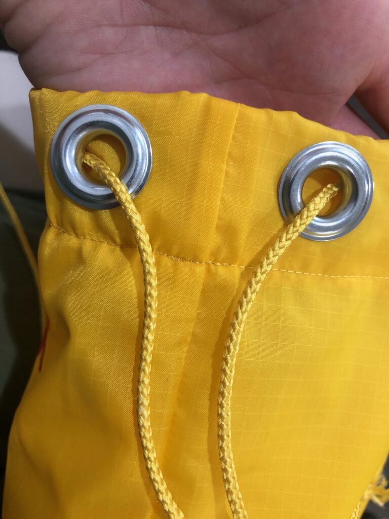 insert cord through casing and eyelets
