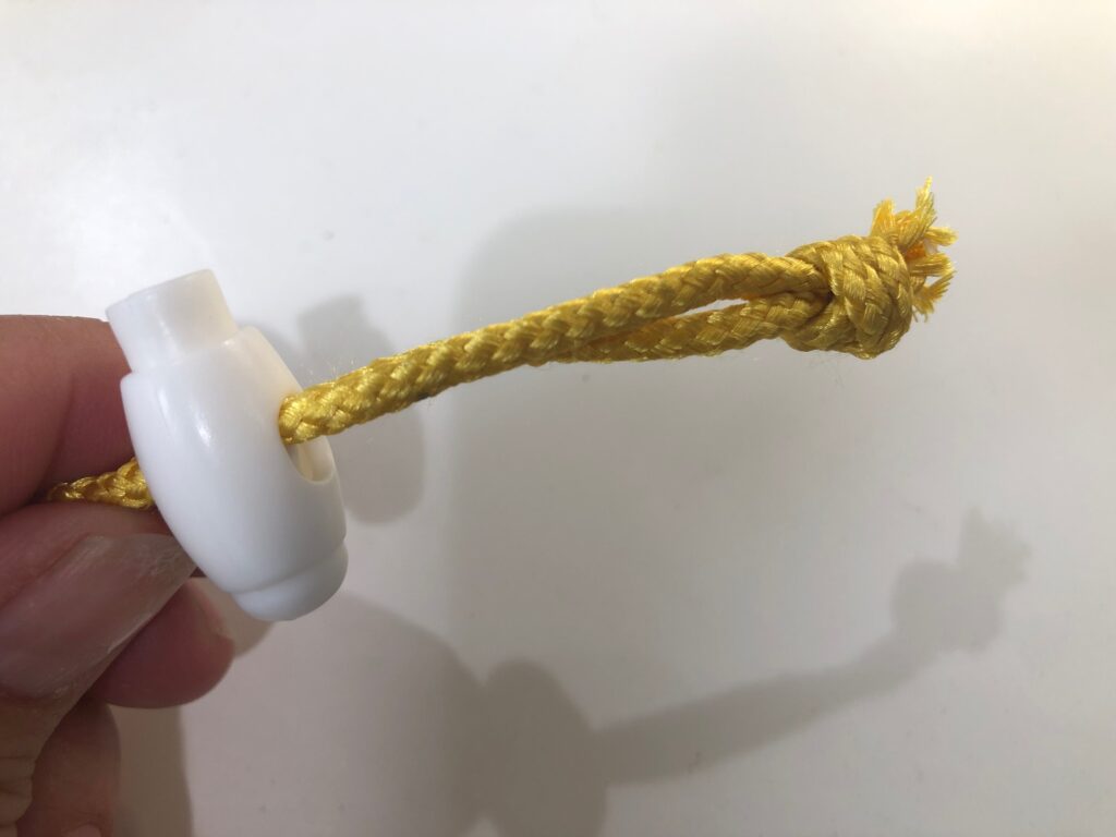 knot ends of cord for drawstring bag