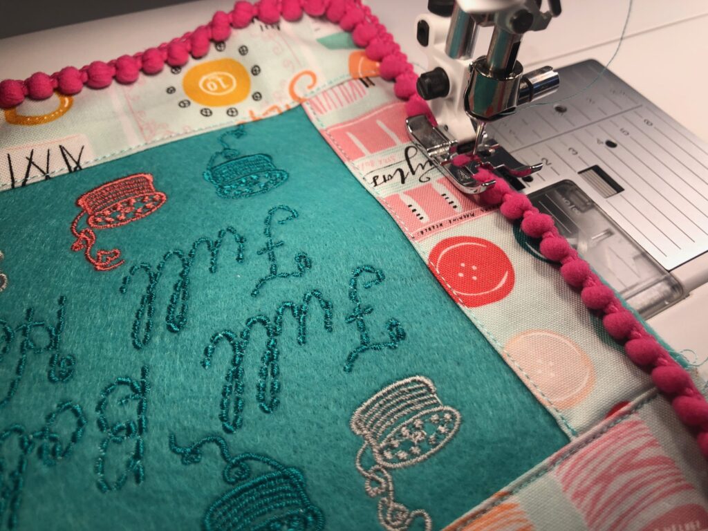 basting trim to sewing themed pillow front