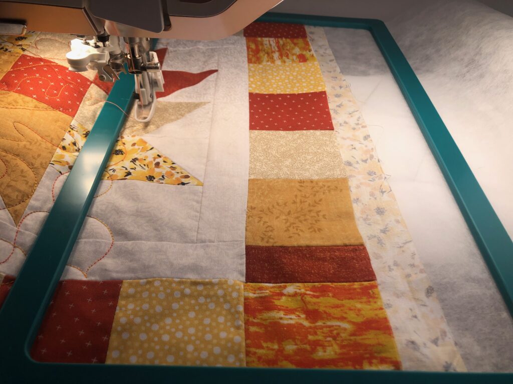 table runner with quilted leaves and stabilizer