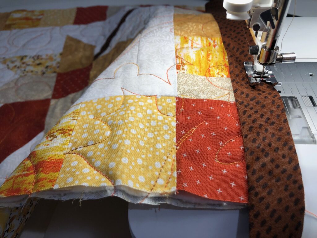 applying binding to quilted leaves table runner
