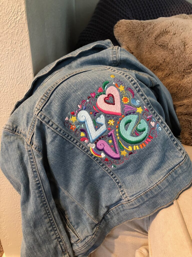 finished jacket with denim embroidery