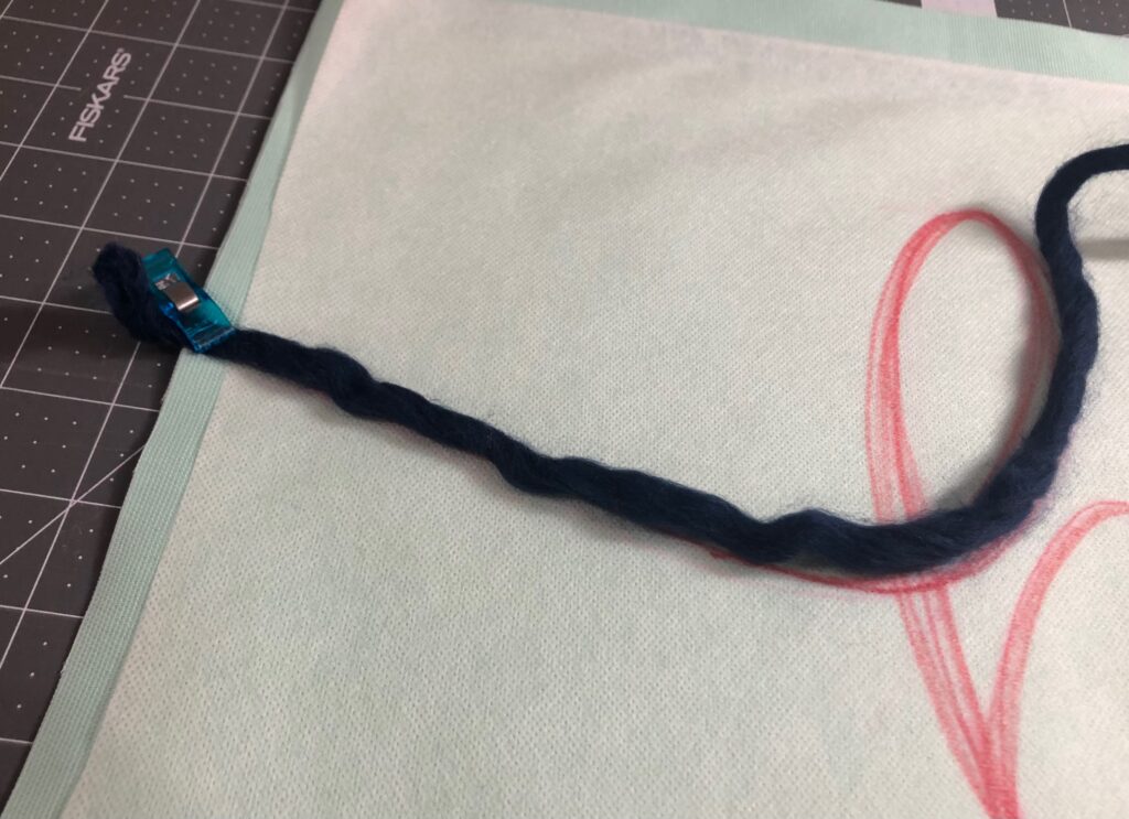 pin yarn to edge of fabric