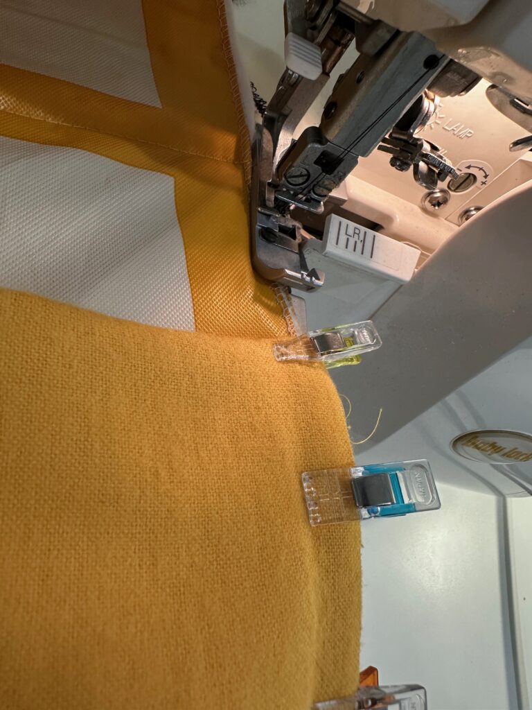stitching pocket lower edge to picnic blanket edge