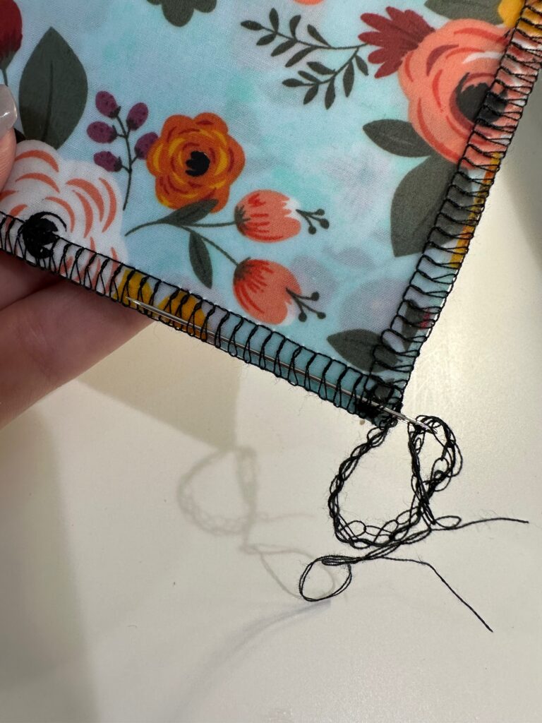 thread serger tail through previous stitching