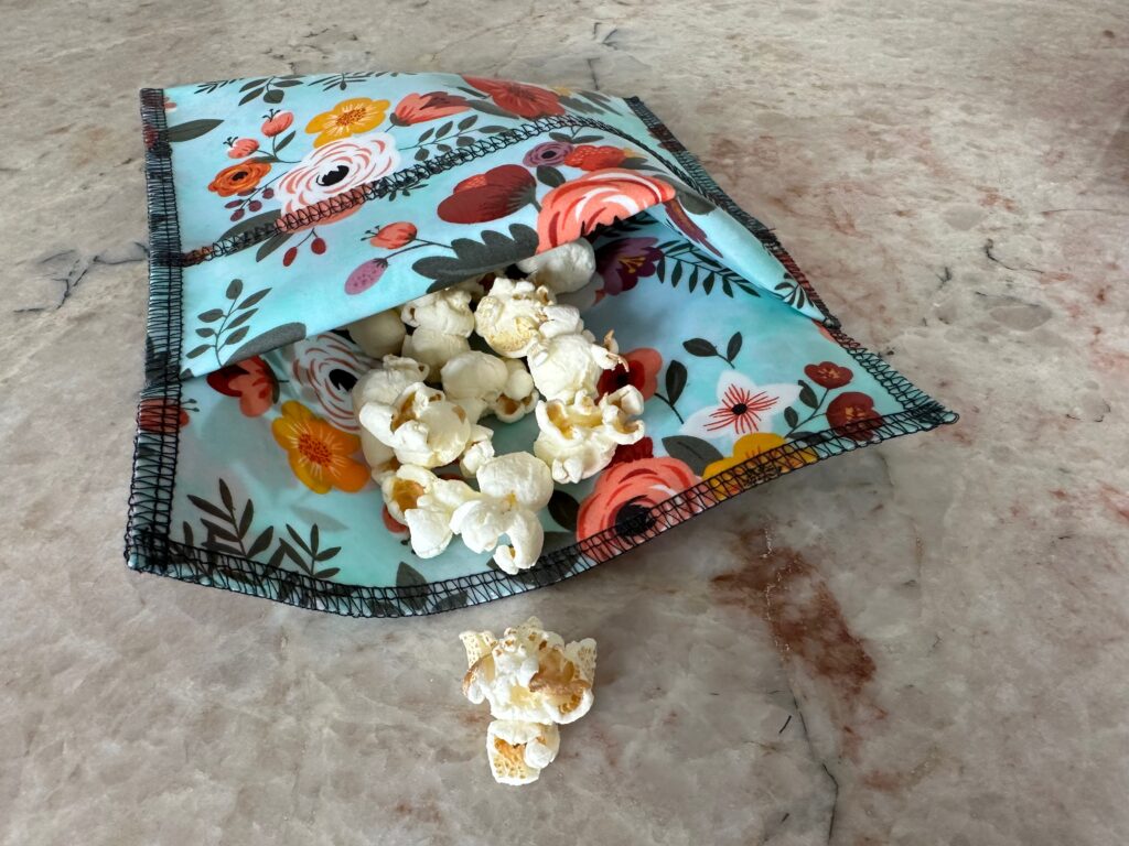 serger snack pouches with popcorn spilling out
