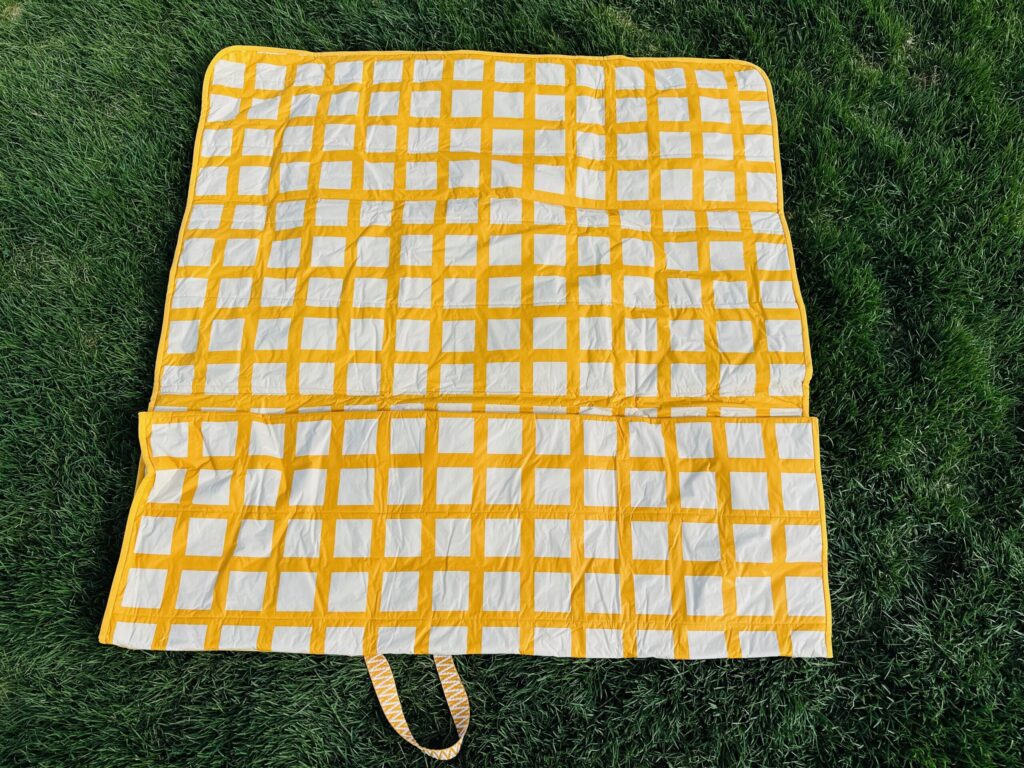 picnic blanket folded along one side