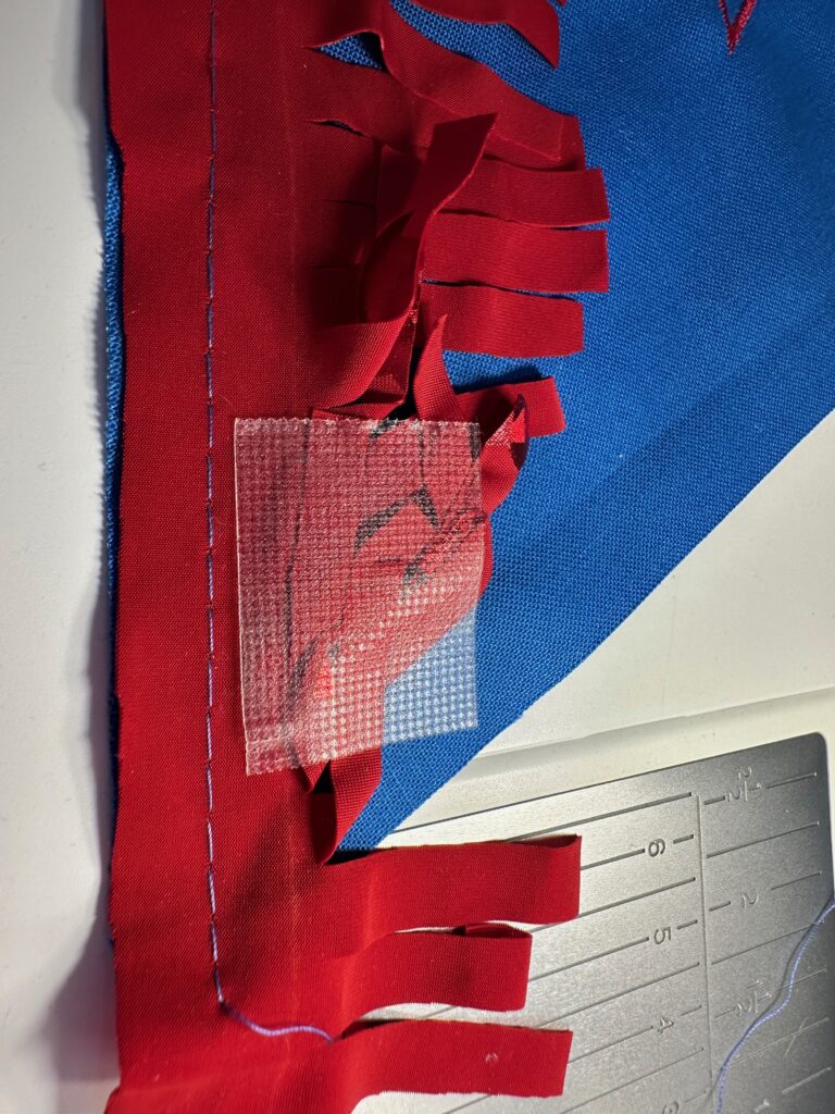 taping fringe away from stitching