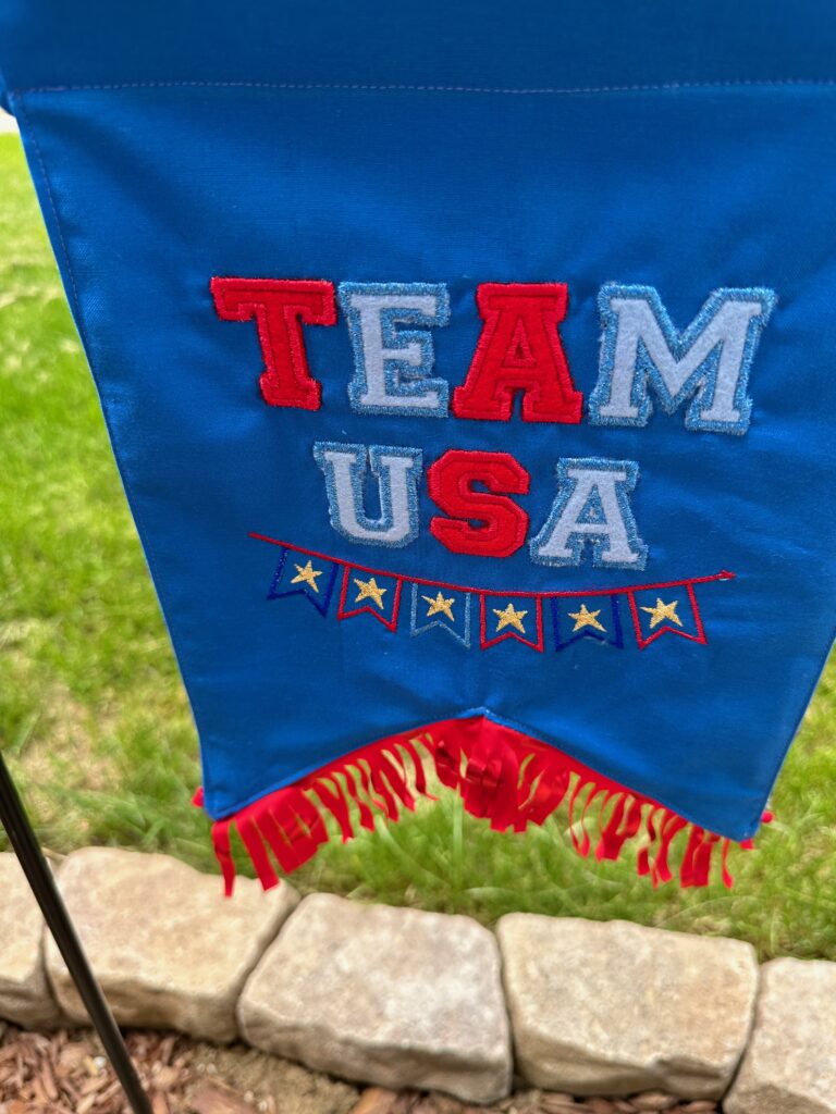 Team USA Appliqué Garden Flag in front yard