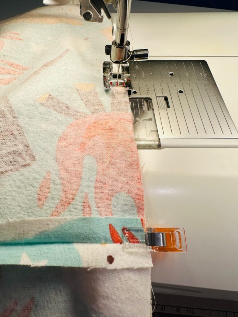 stitching upper edge of drawstring bag