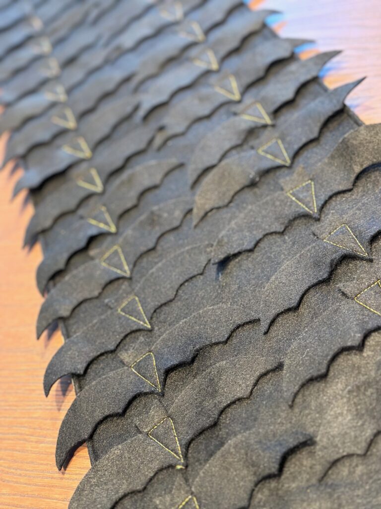 bats in a row with gold stitching