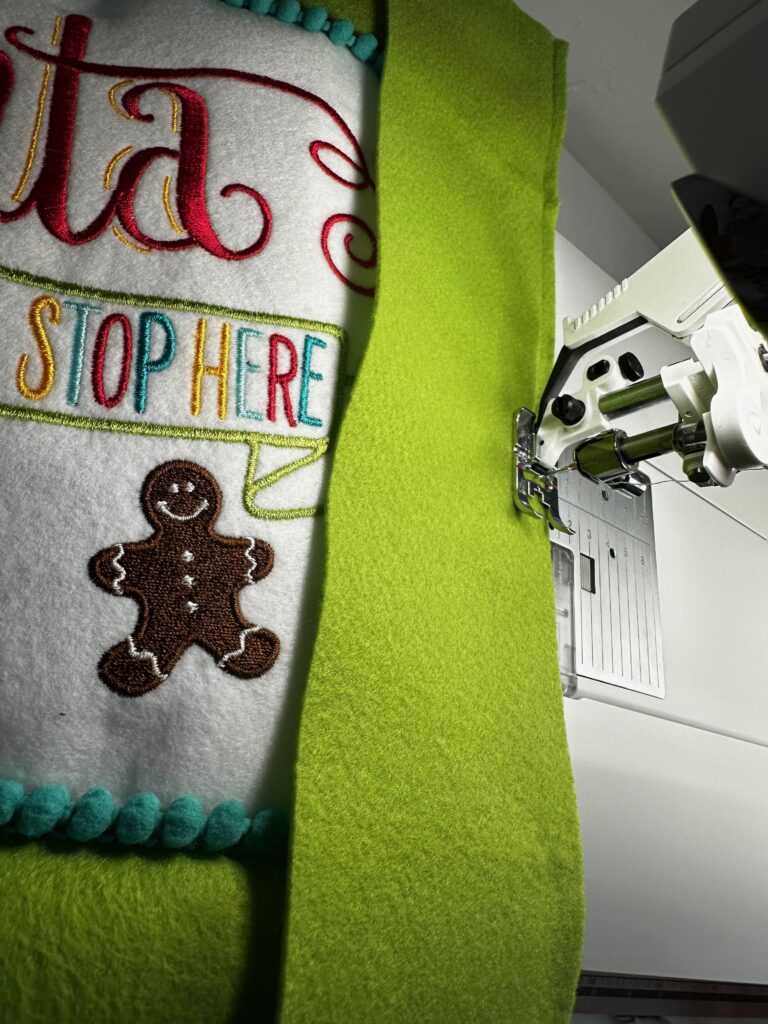 stitch long rectangles to sides of santa sign