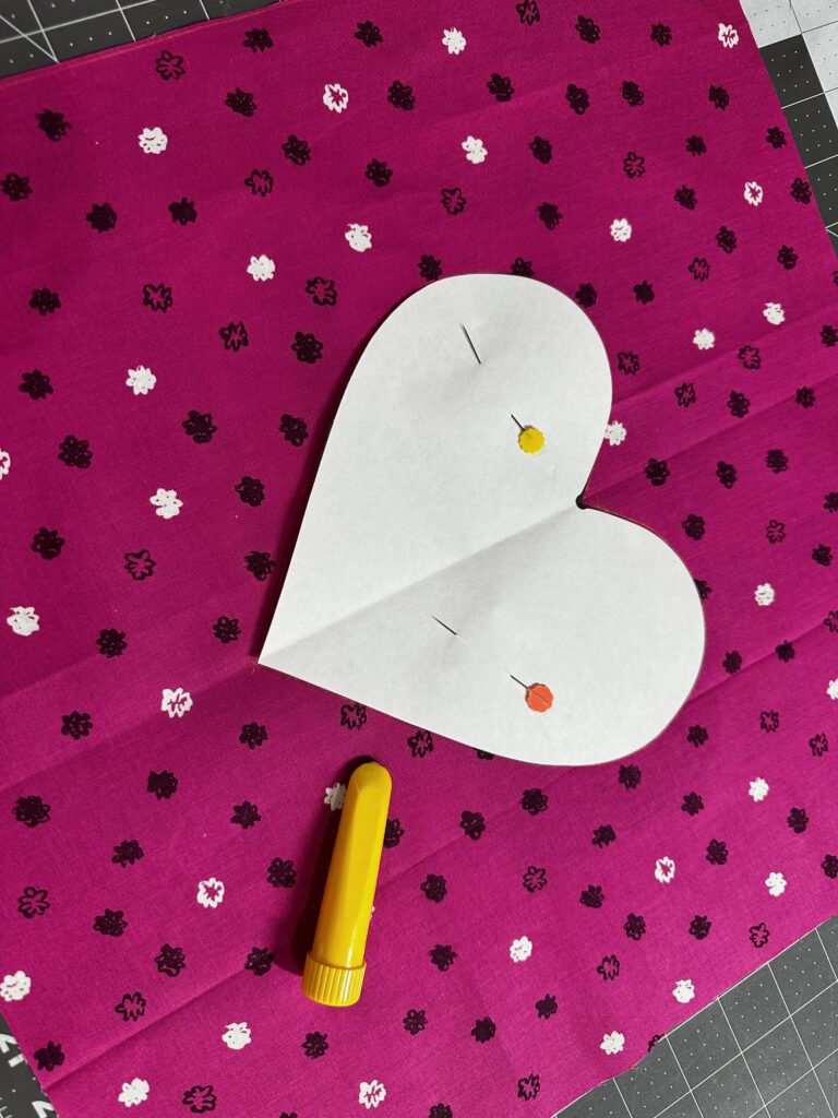 pin heart template to fabric