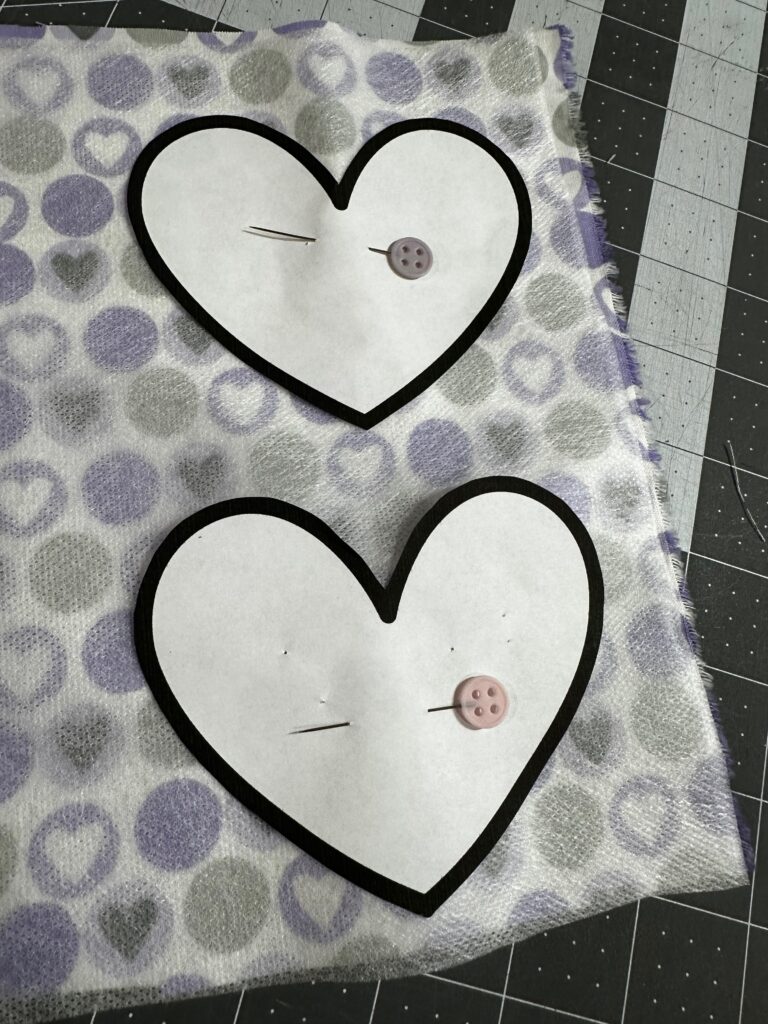 Puffy Heart applique templates on fabric with pins