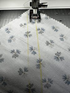 sewing marked lines for half square triangles