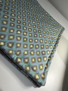 topstitching closeup on exterior right side of backpack organizer