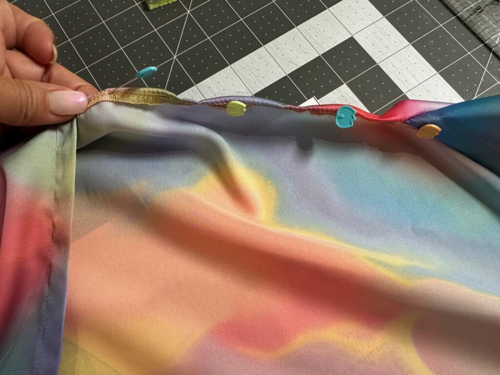 folding open neckline edge to wrong side of coverup