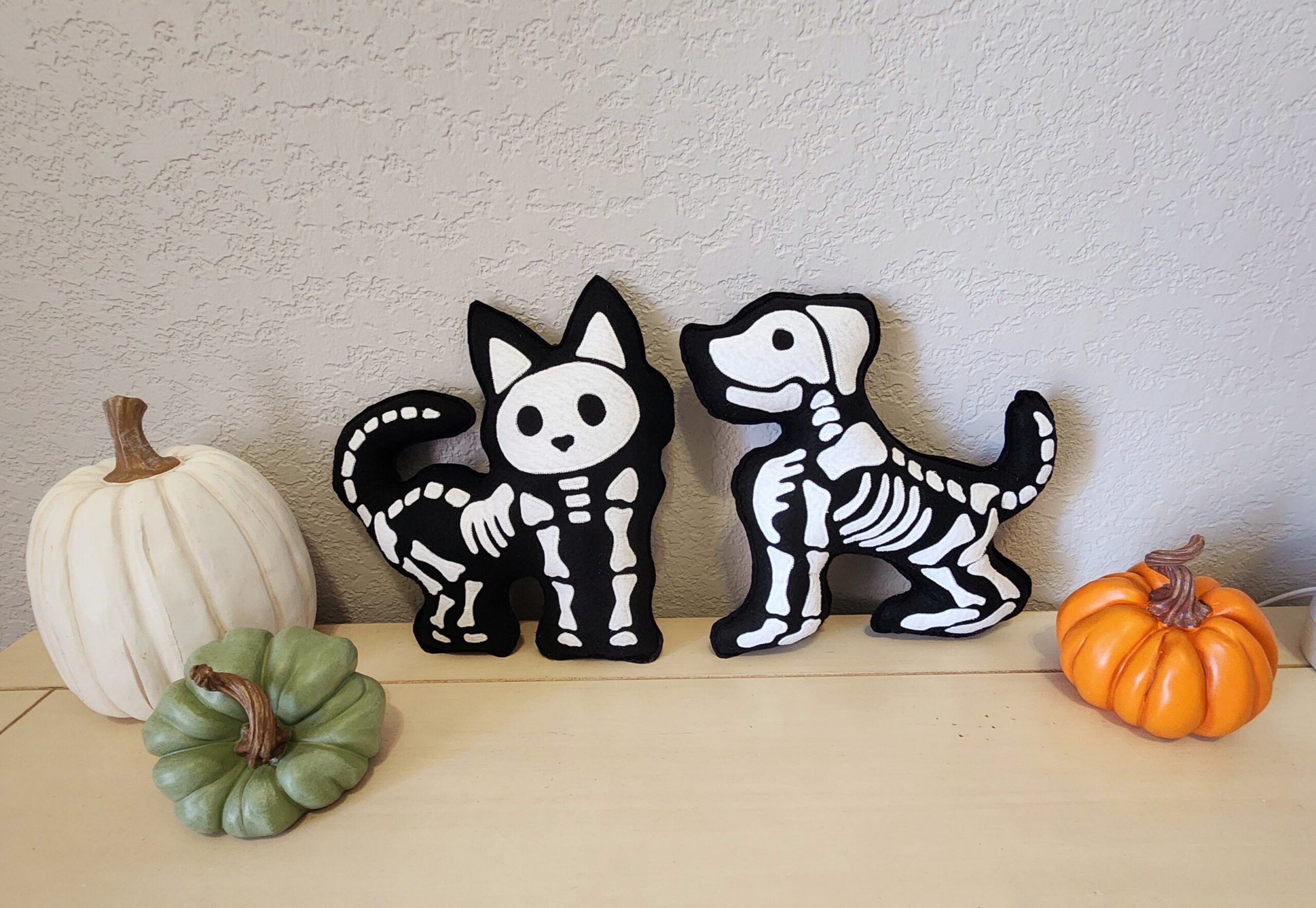 finished set of skeleton appliqué pillows