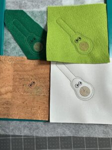 four finished avocado guys showing different fabrics