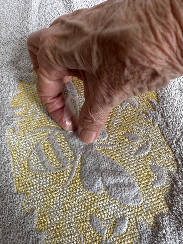 tearing away excess Solvy inside embossed design
