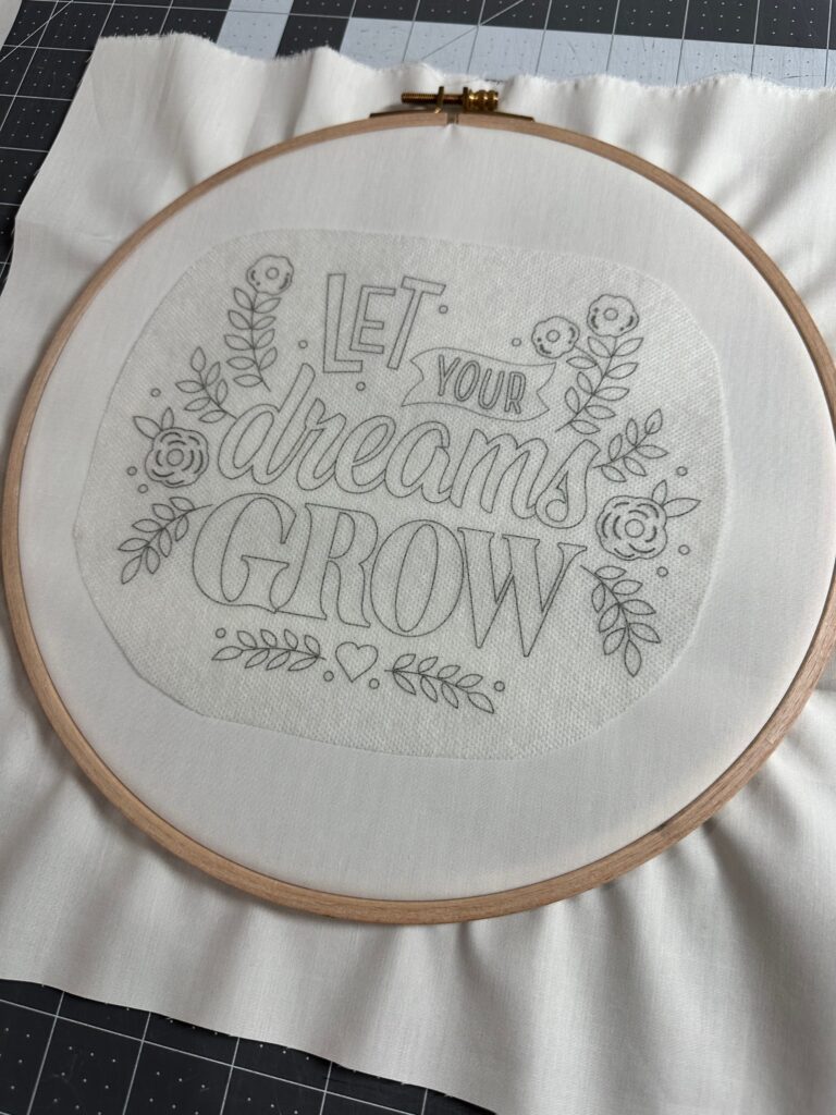placing pattern transfer sticker onto fabric right side