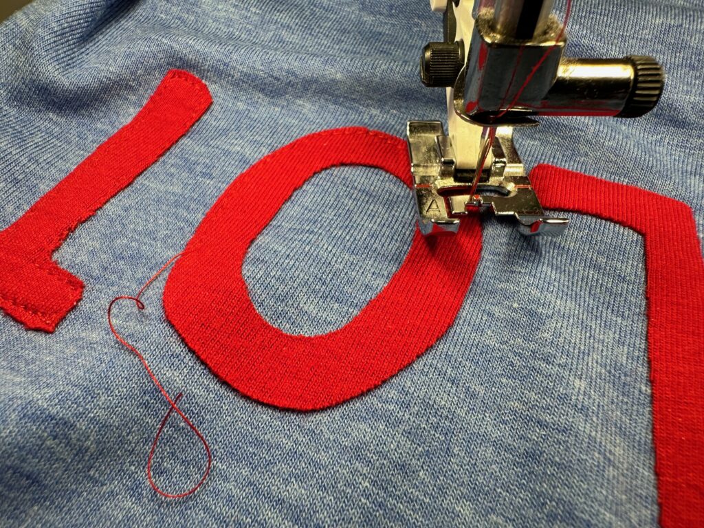 stitching applique letters to t-shirt