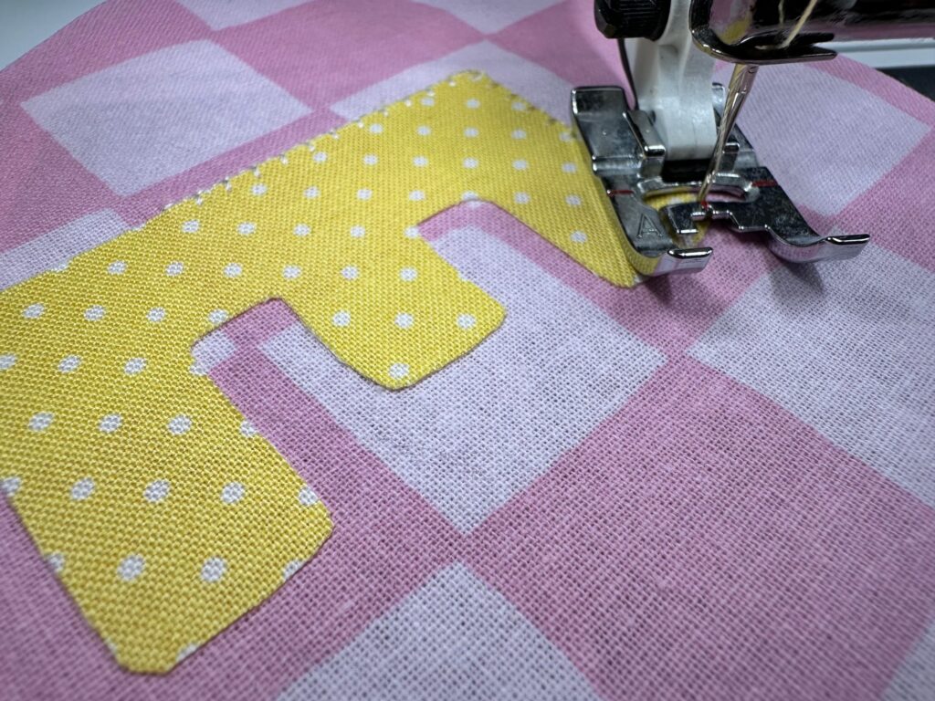 stitching letter to bunting flag